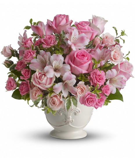 Flowes in shades of pink in a charming white container